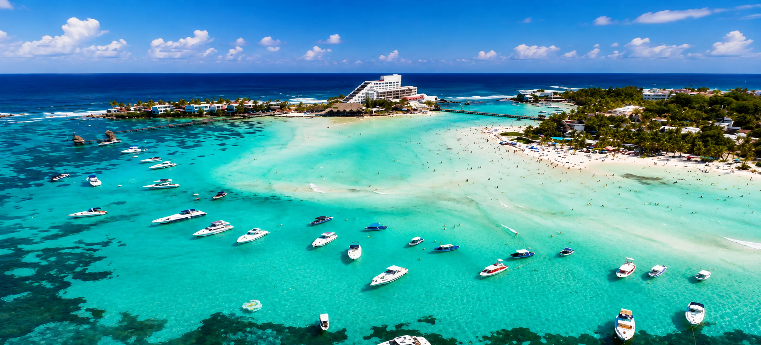 Cancun island excursion with boats in turquoise Caribbean water Aerial view of a tropical Cancun island destination featuring crystal-clear turquoise Caribbean water, white-sand beaches and boats, showcasing an unforgettable Cancun excursion experience.