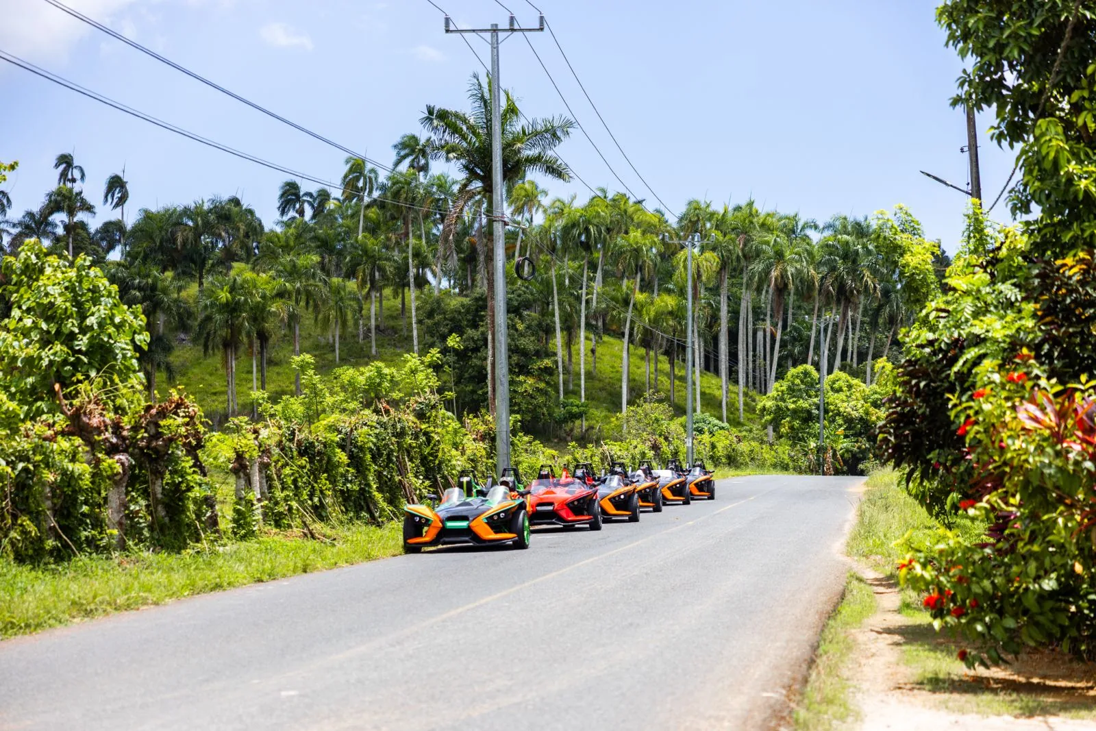 Guided Polaris Slingshot convoy driving through the Dominican countryside near Punta Cana