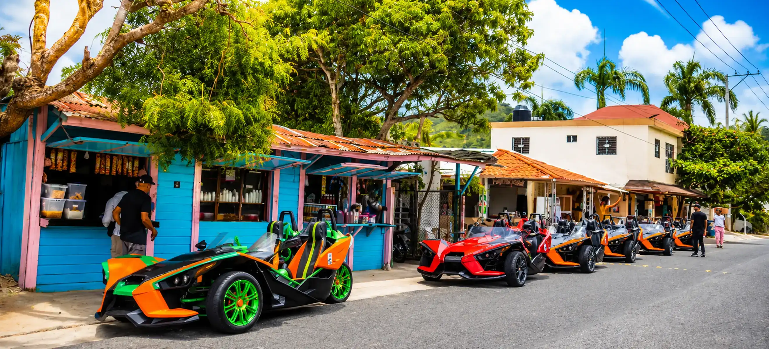 Colorful Polaris Slingshot convoy visiting a Mexican village during a Cancun countryside tour