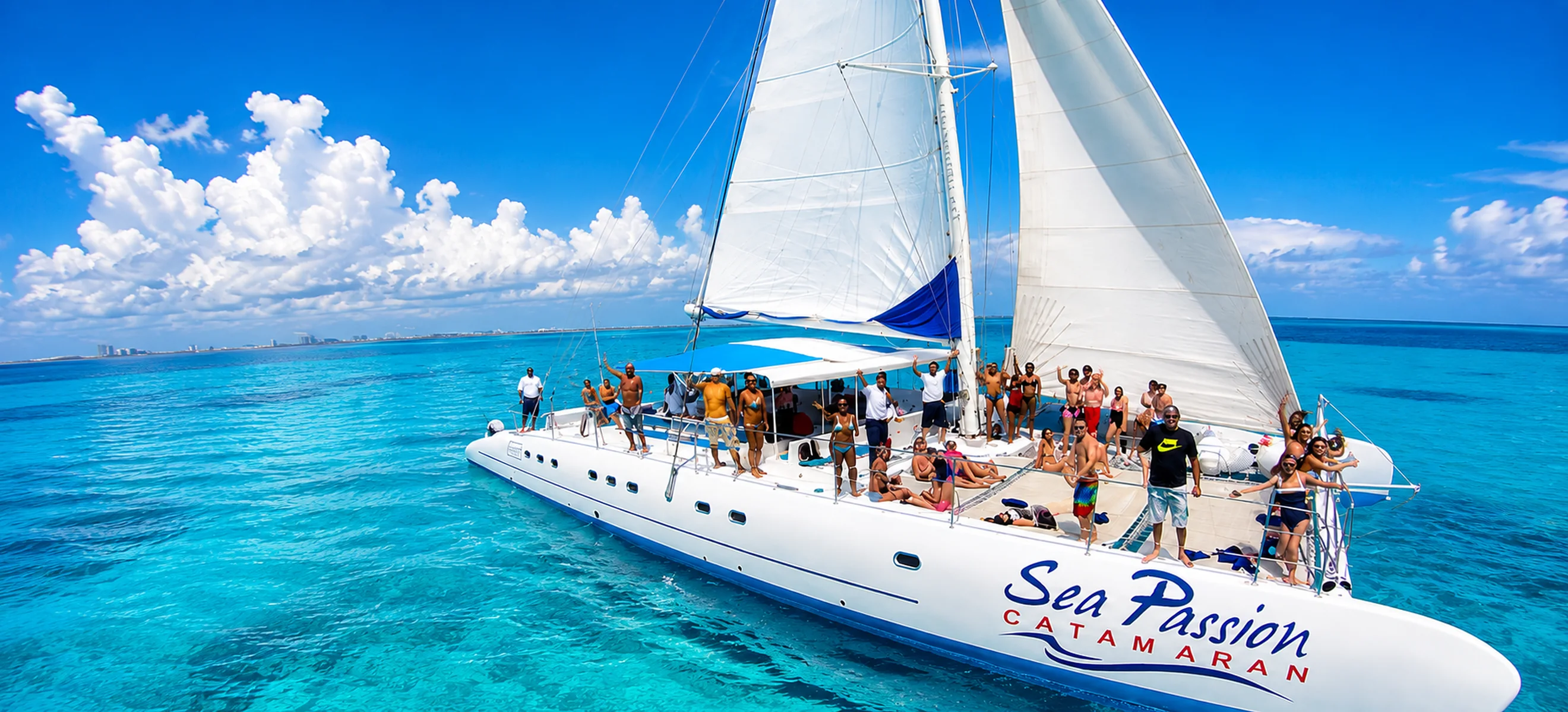 Isla Mujeres shared catamaran tour from Cancun sailing on turquoise Caribbean waters